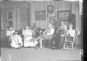 George Eastman and guests inside Lodge, Oak Lodge Trip