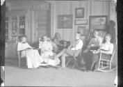 George Eastman and guests inside Lodge, Oak Lodge Trip
