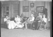 George Eastman and guests inside Lodge, Oak Lodge Trip