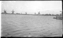 [Windmills by harbor]
