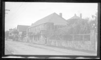 [Street scene with house]