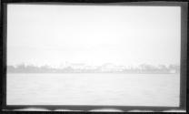 [View of shore from river]
