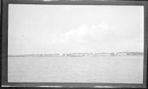 [View of shore from river]