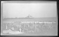 [Beach view, pier in distance]
