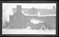 [Front of snow covered house]