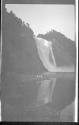 [Three women by river below falls]