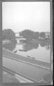 [View of canoes on lake in park]