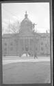 [People outside domed building]