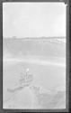 [Passenger boat on river by dock]