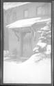 [Front of snow covered house]