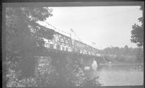 [Group of people on trestle bridge]