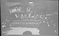 [Women in uniform marching in parade]
