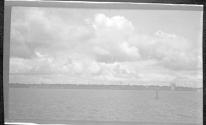 [Clouds over river]