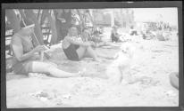 [People & dog on beach]