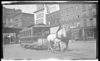 [Horse drawn trolley car on street]