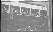 [People on passenger ship at dock]
