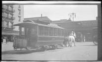 [Horse drawn trolley car on street]