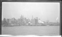 [Cityscape from river]