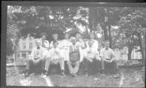 [Group portrait in park, Charles Zoller seated in middle]