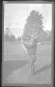 [Man in indian costume with bow & arrow]