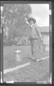 [Man with pail & milkcan]