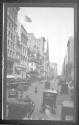 [Street scene with automobiles]