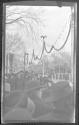 [Large group of people along parade route]