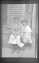 [Two women on porch steps]