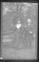 [Man & woman in costume in yard]