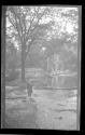 [Man by stream in park]
