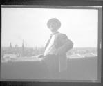 [Zoller (?) on roof overlooking city]
