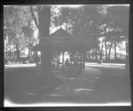 [Woman in gazebo in park]