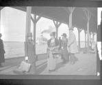 [People on dock waiting for passenger ship]