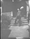[Zoller (?) on porch steps]