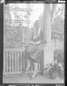 [Portrait of woman on porch]