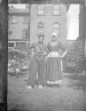 [Man & woman in native costume]