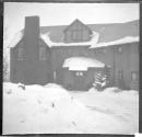 [Front of snow covered house]