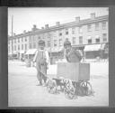 Boys with cart on street