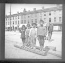 Four boys standing on street