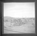 Horse carts near train tracks