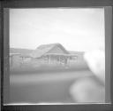Adobe house along train tracks
