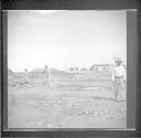 People at work along railroad tracks