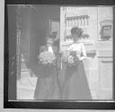 Women holding bouquets