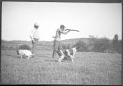 Men shooting with dogs