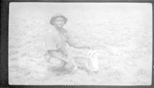 Native posing with dead ? gazelle, African Safari