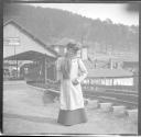 Ellen Andrus Dryden standing in front of paint store