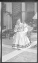 Nell Newhall seated in Conservatory