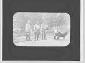 Eastman and companions with dog, Newfoundland Trip