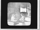 Children in front of a fireplace