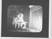 Children in front of a fireplace